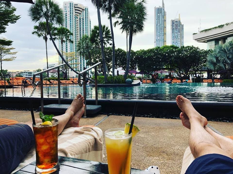 Relaxing poolside at the Shangri-La Bangkok hotel