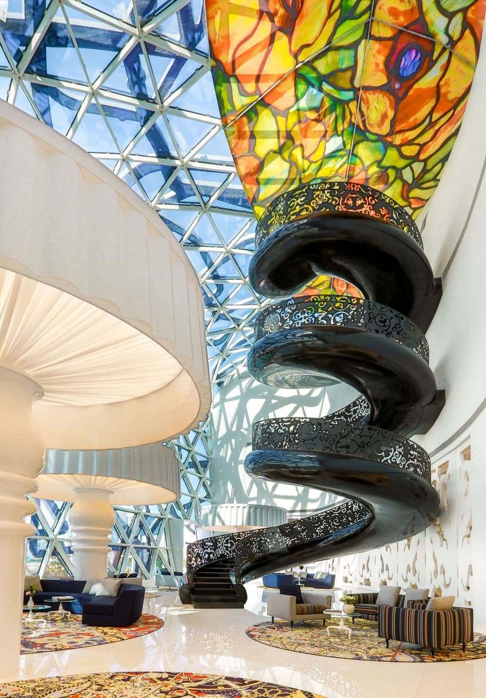 hotel lobby with large black spiral staircase