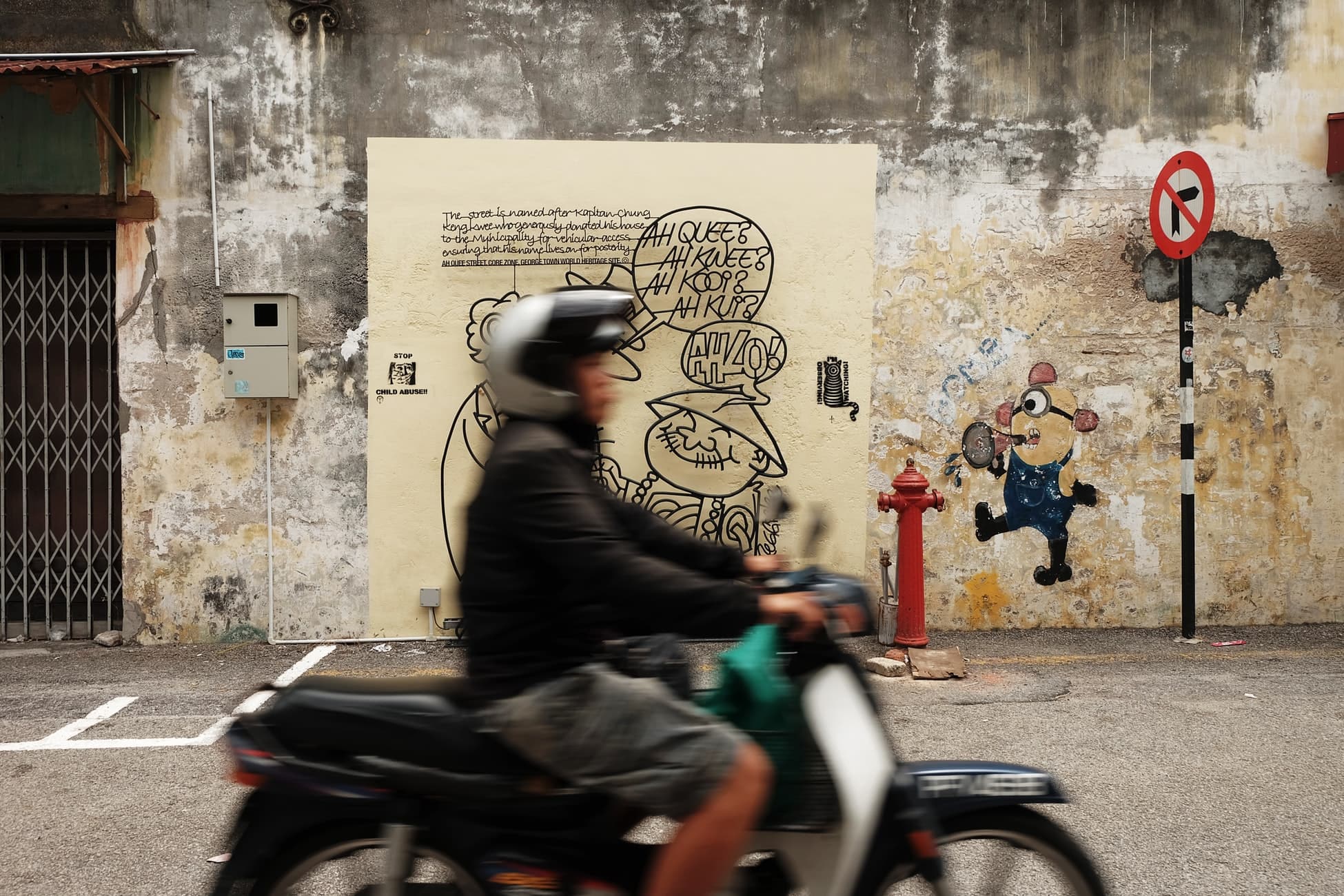 man on motorcycle george town street art penang